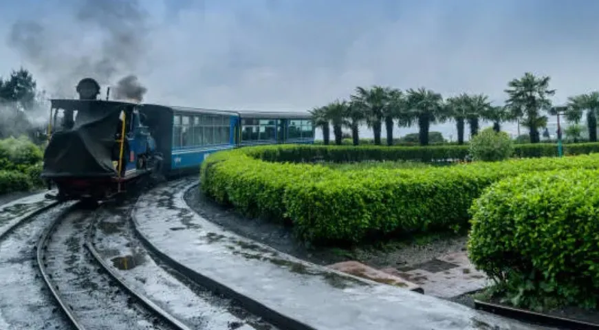 UNESCO World Heritage Darjeeling Himalayan Railway Toy Train on tracks.